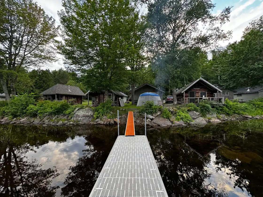 The cabins seen from the end of the camp dock