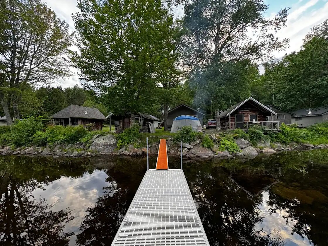 Cabins along the Molunkus Lake shoreline seen from the dock