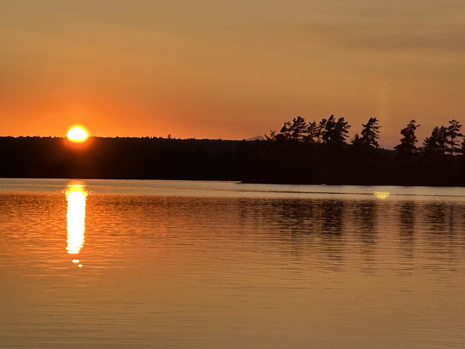 Amber sunset over Molunkus Lake