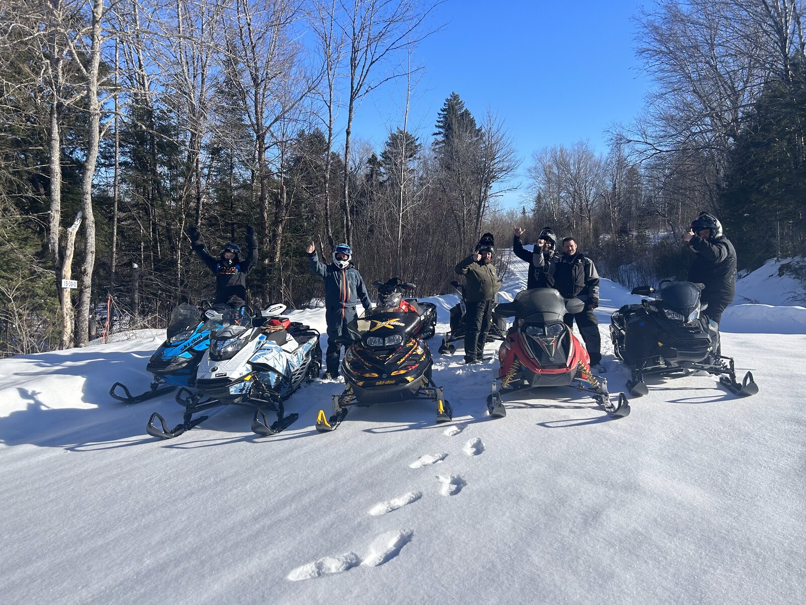 Snowmobile crew on the trail near Molunkus Lake